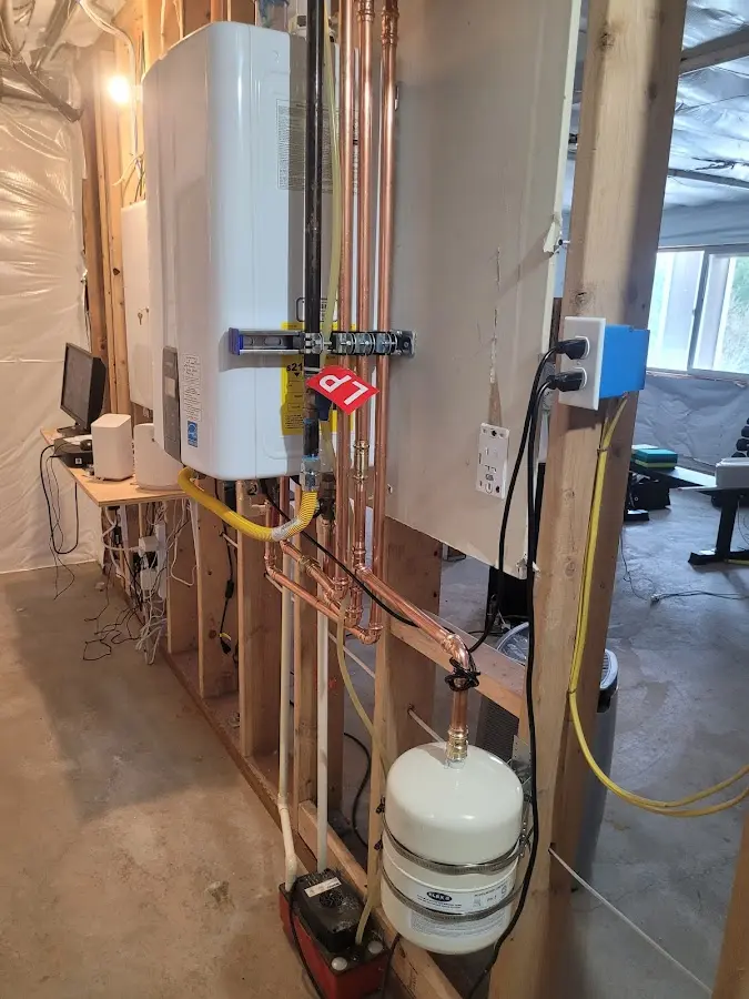 Licensed plumber repairing a kitchen sink in Redstone